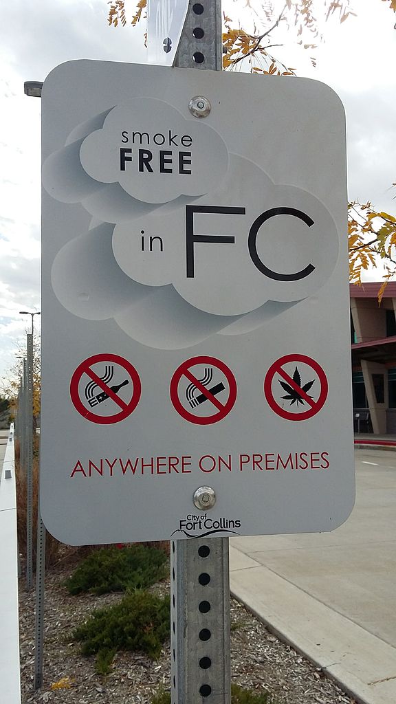 sign at the park that reads, "smoke free in FC (Fort Collins)"