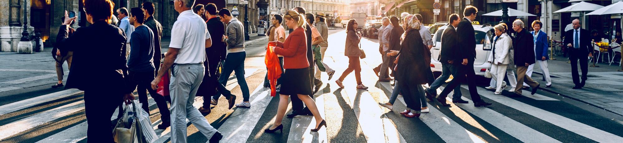 Group of people walking in a crosswalk