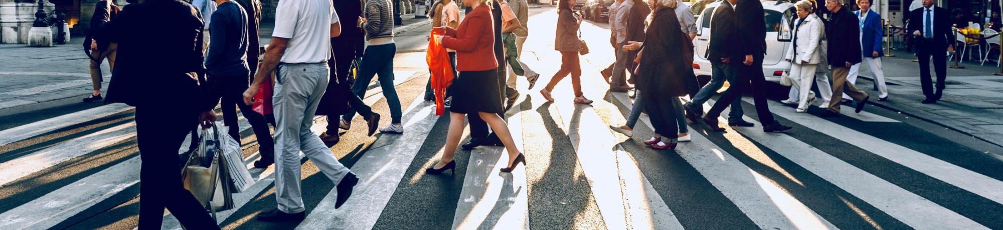 Group of people walking in a crosswalk